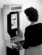 black and white photo of woman using old tty phone