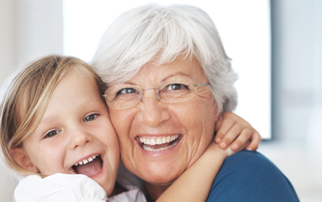 Grandaughter hugging grandmother Grandaughter hugging grandmother