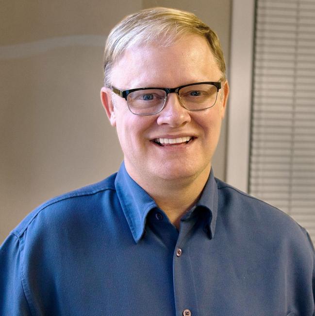 Rex Bank, Director of Audiology A picture of a man in a blue shirt, Rex Banks.